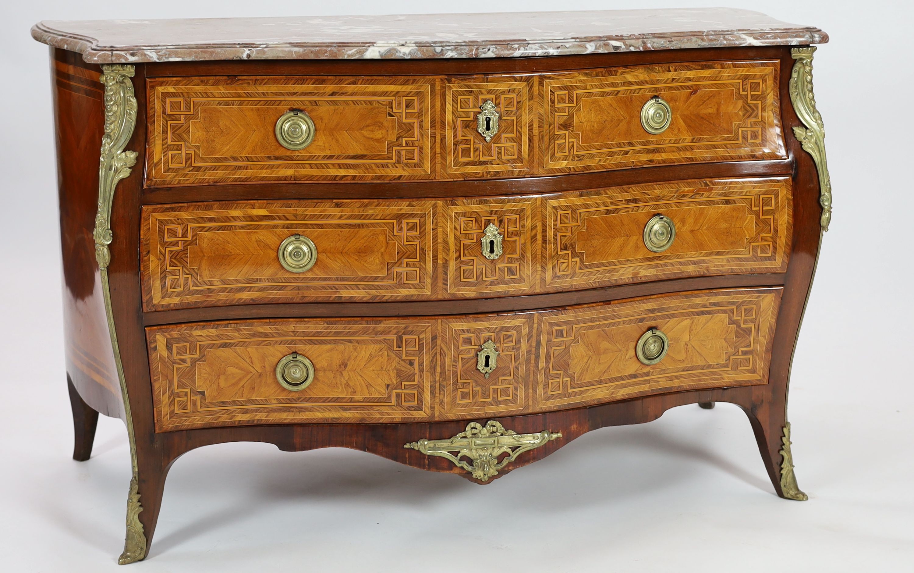 A late 18th century French banded kingwood serpentine marble top commode, with gilt metal mounts, stamped H. Wirtz to top, width 148cm, depth 69cm, height 90cm